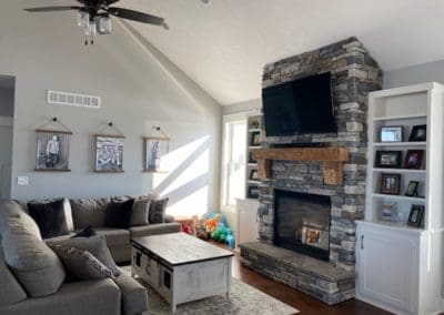 Living room interior with fireplace by Downey Construction